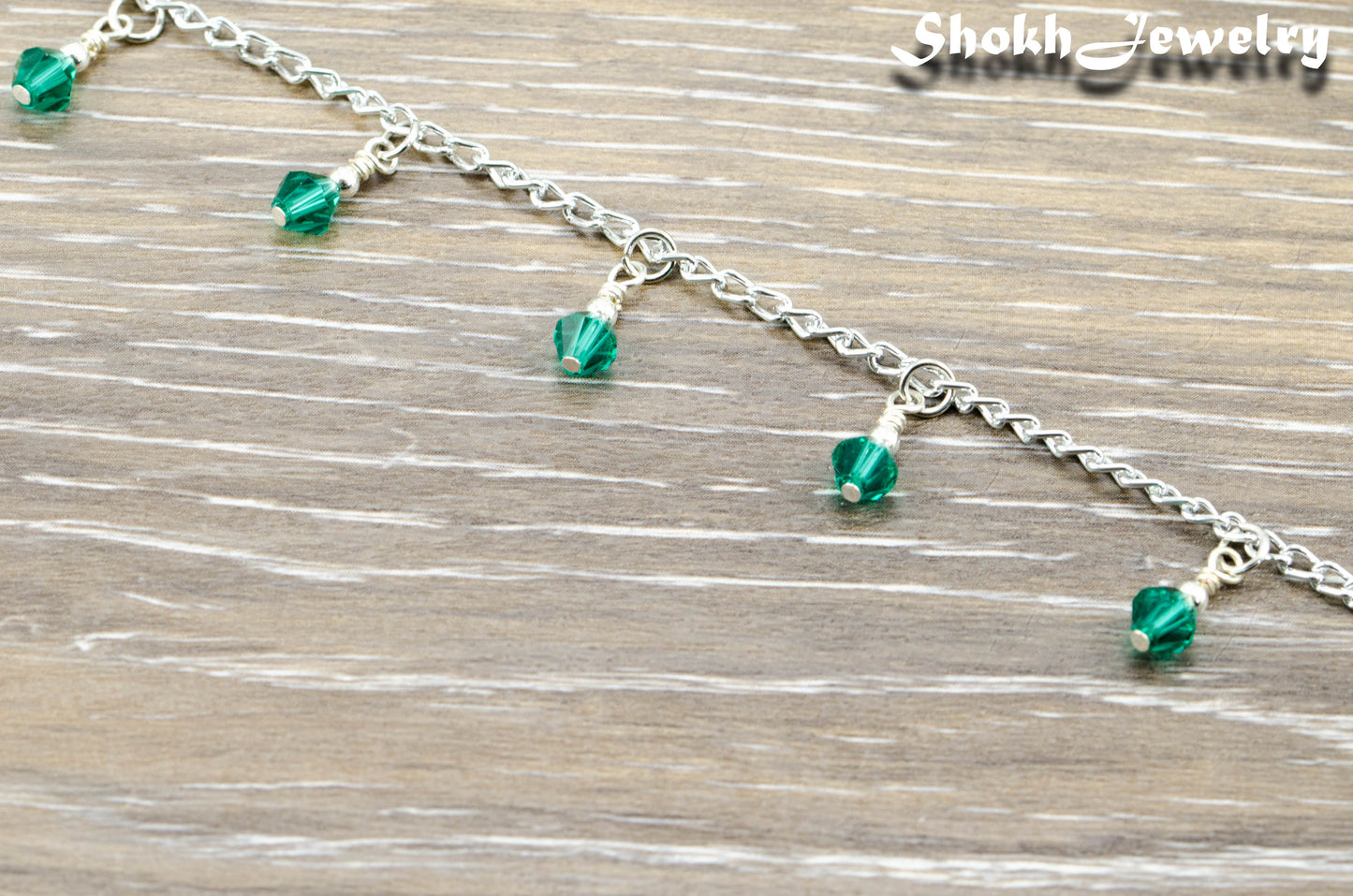 Close up of Green Glass Crystal Dangle and Chain Anklet.