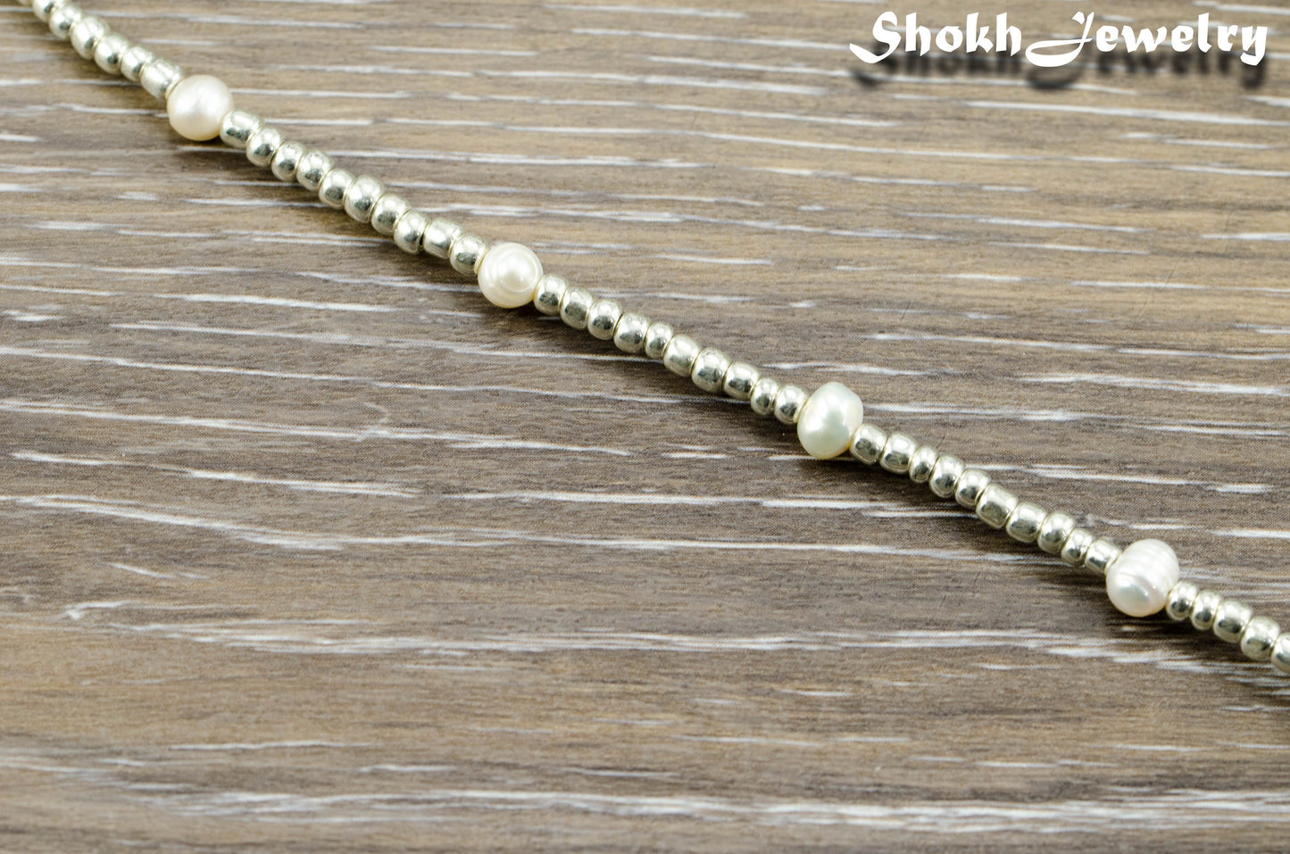 Top view of Freshwater Pearl and Silver Seed Bead Anklet.