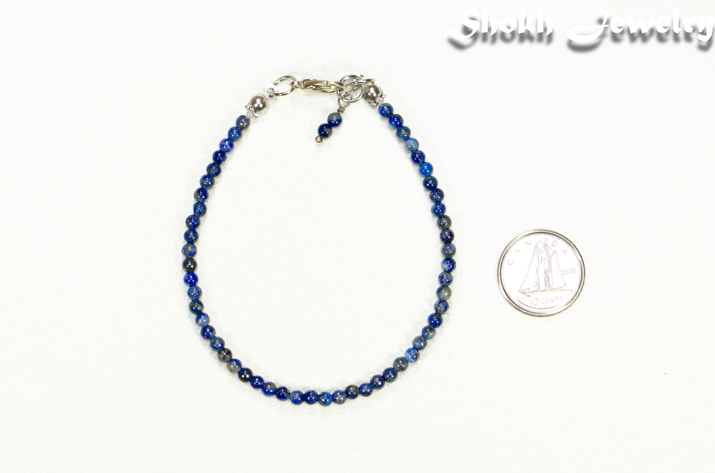 3mm Lapis Lazuli Anklet beside a dime.