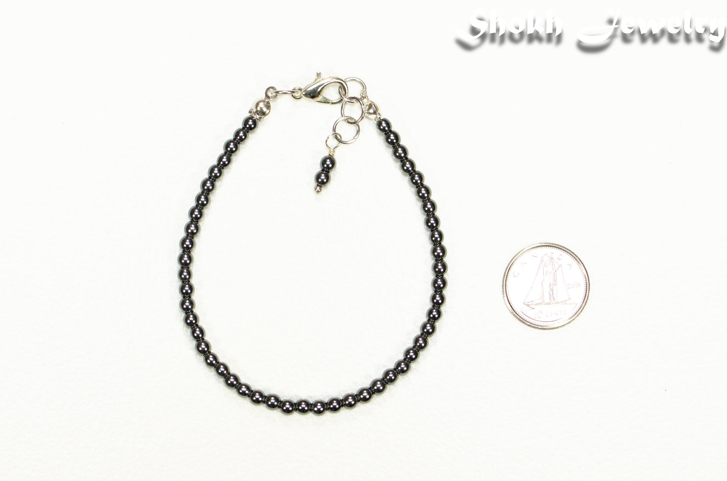 3mm Natural Hematite Anklet beside a dime.