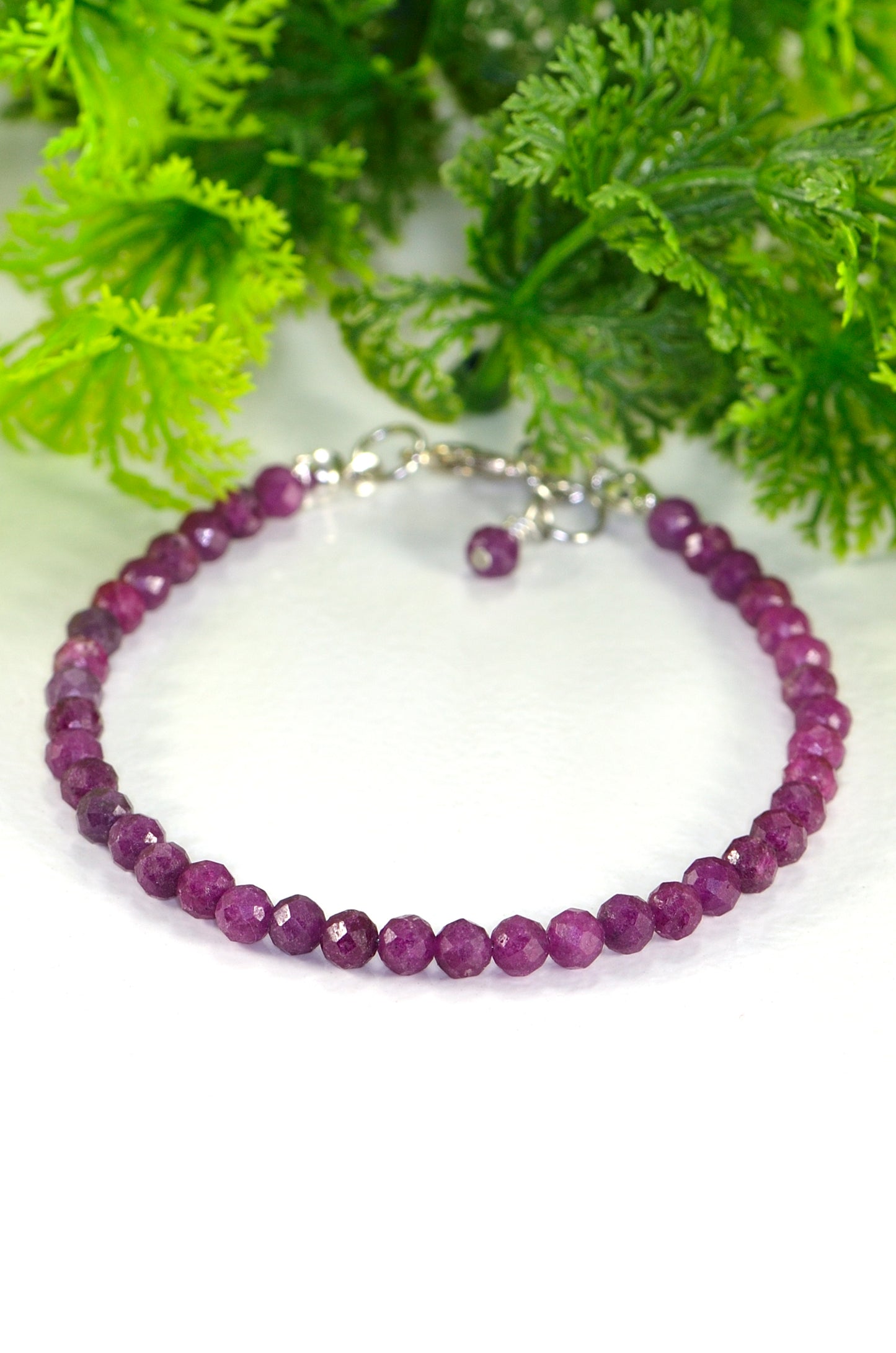 4mm Faceted Ruby Anklet made with raw ruby crystal beads strung on sturdy bead stringing wire, finished with a lobster clasp and 0.5 inch extender chain and a cute little dangle.