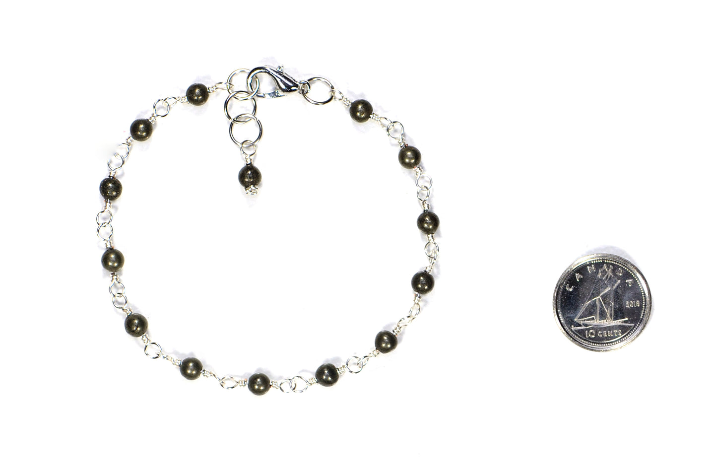 4mm Natural Pyrite Link Anklet beside a dime.