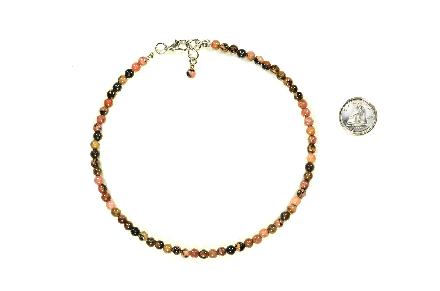 4mm Natural Rhodonite Choker Necklace beside a dime.