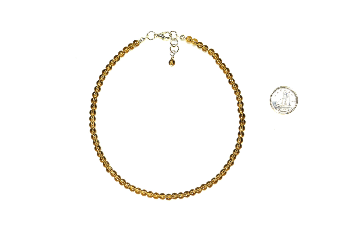 4mm Smokey Quartz Crystal Choker Necklace beside a dime.