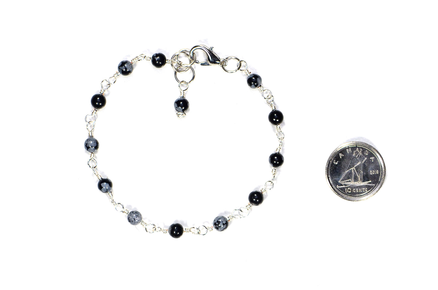 4mm Snowflake Obsidian Link Chain Anklet beside a dime.