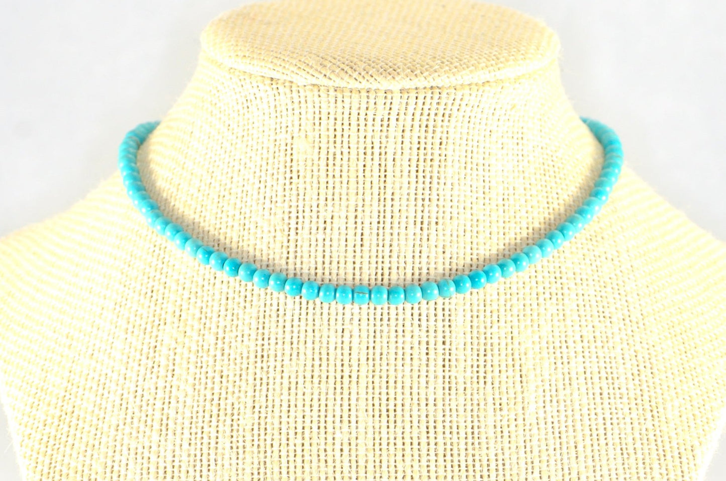 4mm Turquoise Howlite Choker Necklace displayed on a bust.