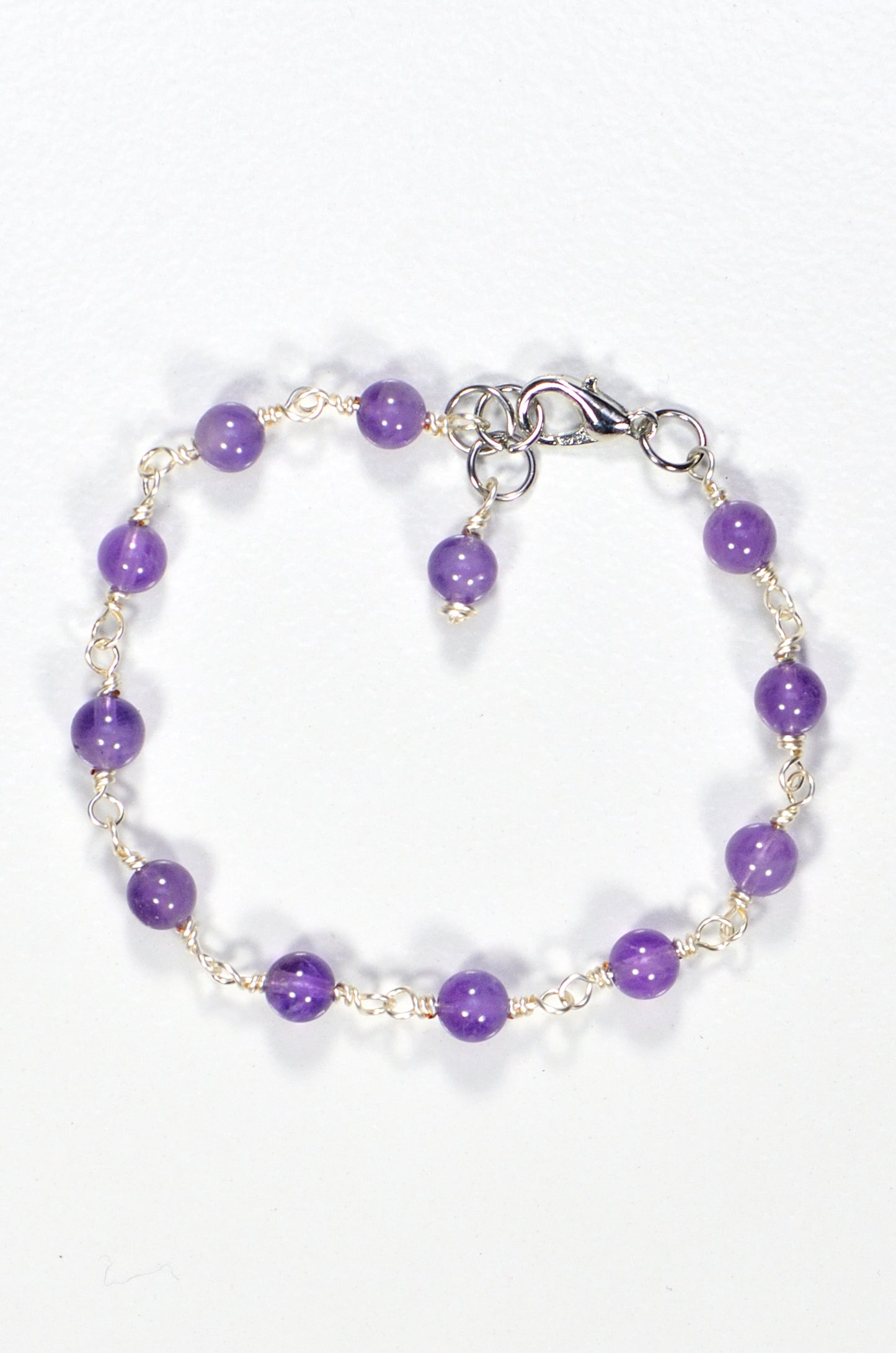 Top view of 6mm Amethyst Link Bracelet.