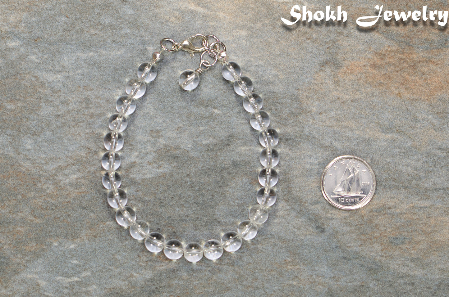 6mm Clear Quartz Beaded Anklet beside a dime.