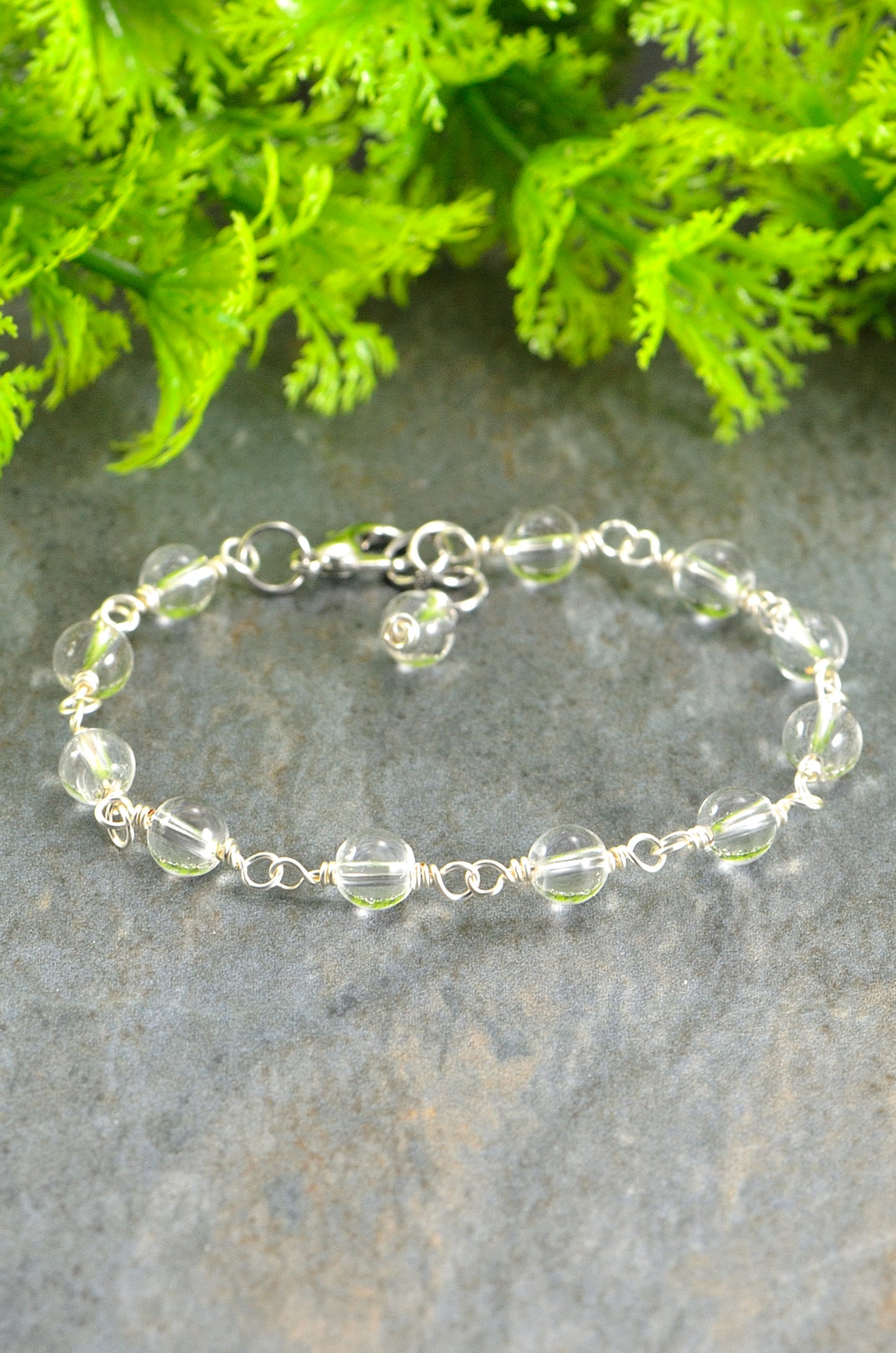 Close up of 6mm Clear Quartz Link Bracelet.