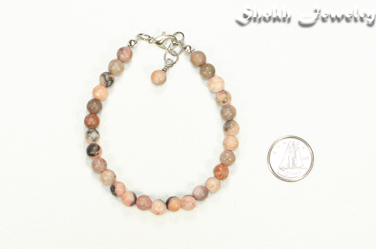 6mm Pink Zebra Jasper Beaded Anklet beside a dime.