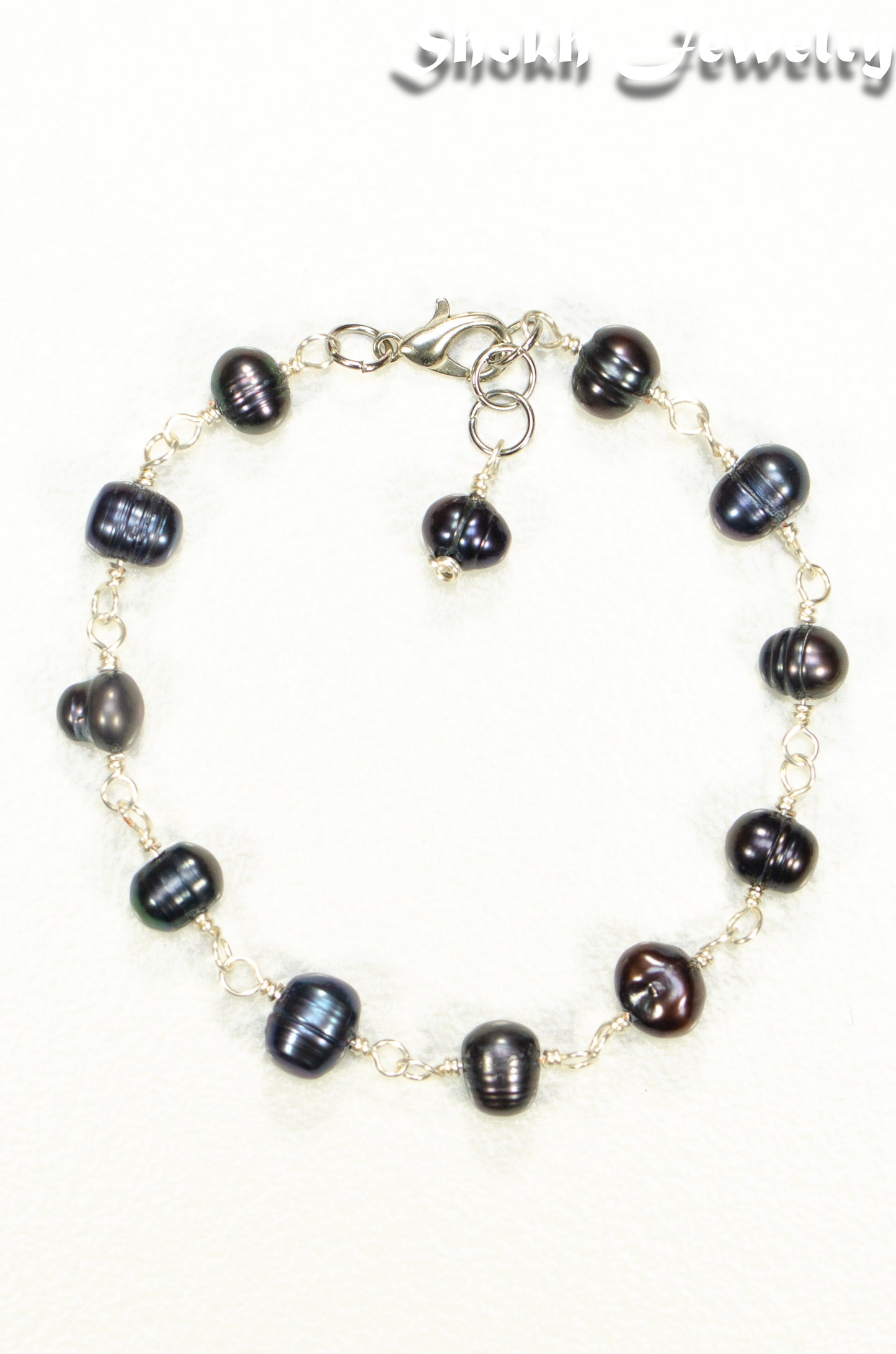 Top view of Black Dyed Freshwater Pearls Link Chain Bracelet.