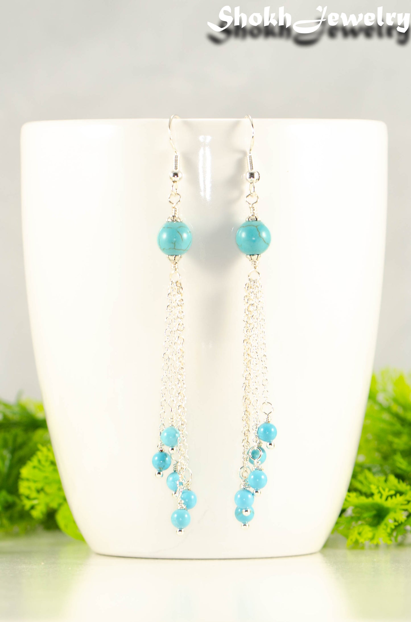 Close up of Cascading Turquoise Howlite Gemstone Drop Earrings.