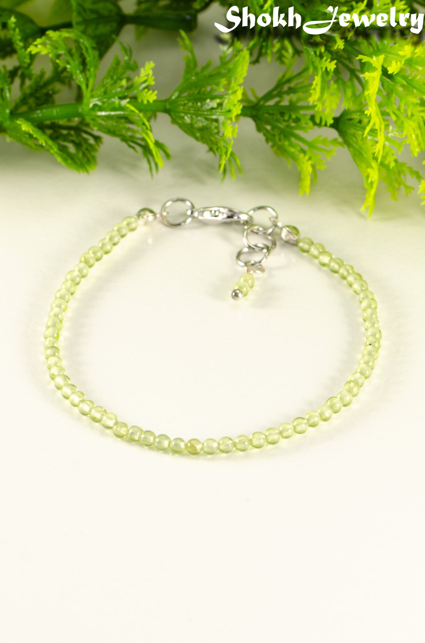 Close up of Dainty Peridot anklet with Clasp.