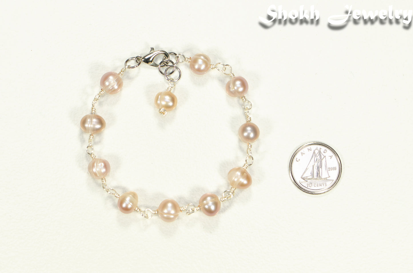 Lavender Freshwater Pearls Link Chain Bracelet on white background.