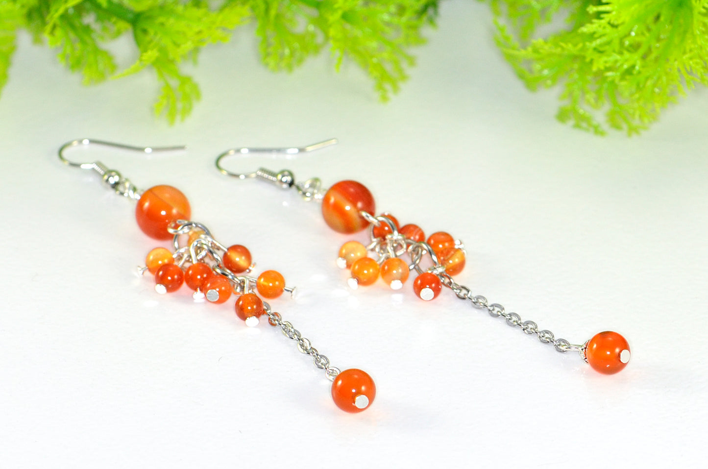 Close up of Long Stainless Steel Chain and Carnelian Earrings.
