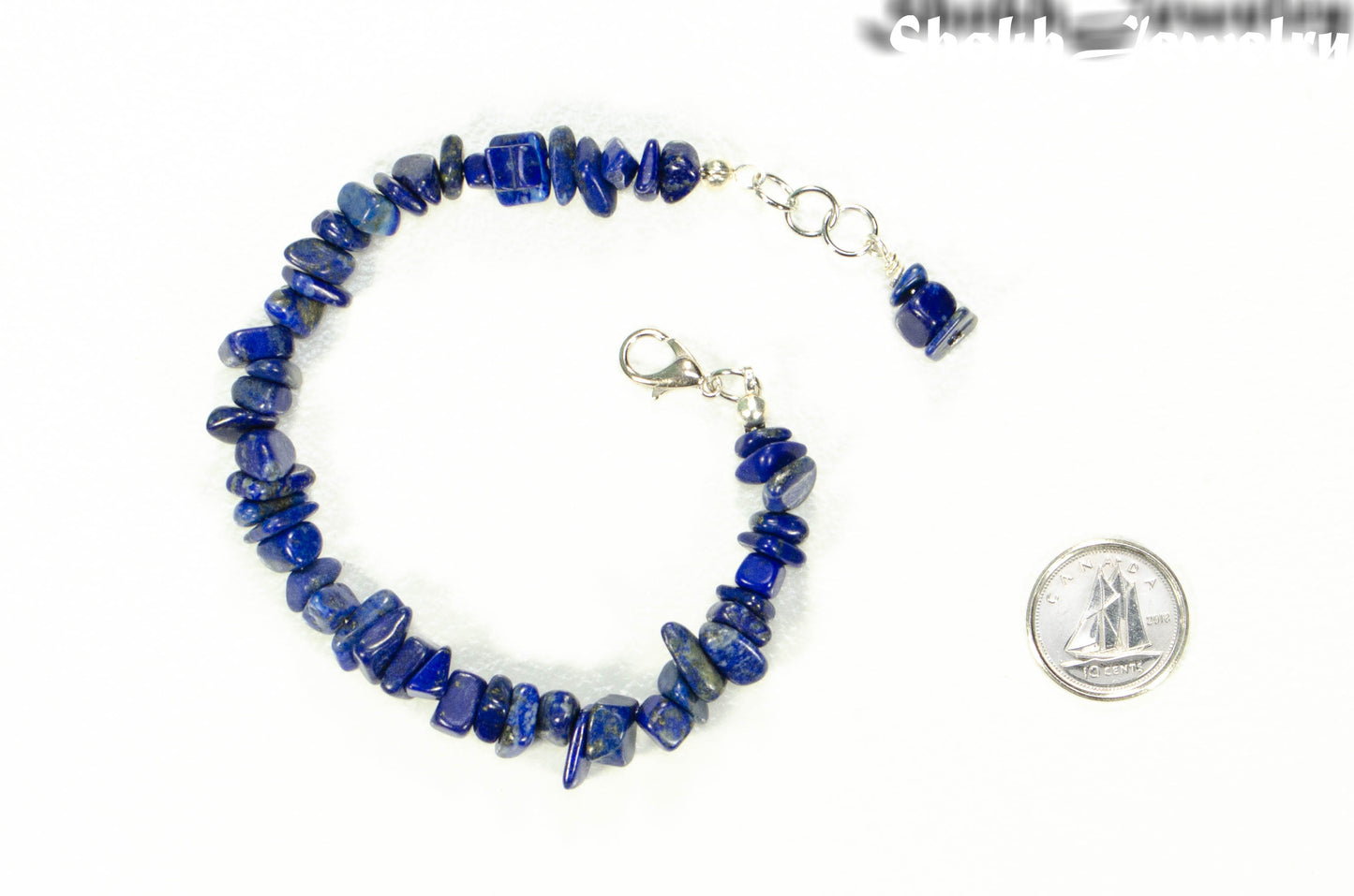 Natural Lapis Lazuli Chip Bracelet beside a dime.