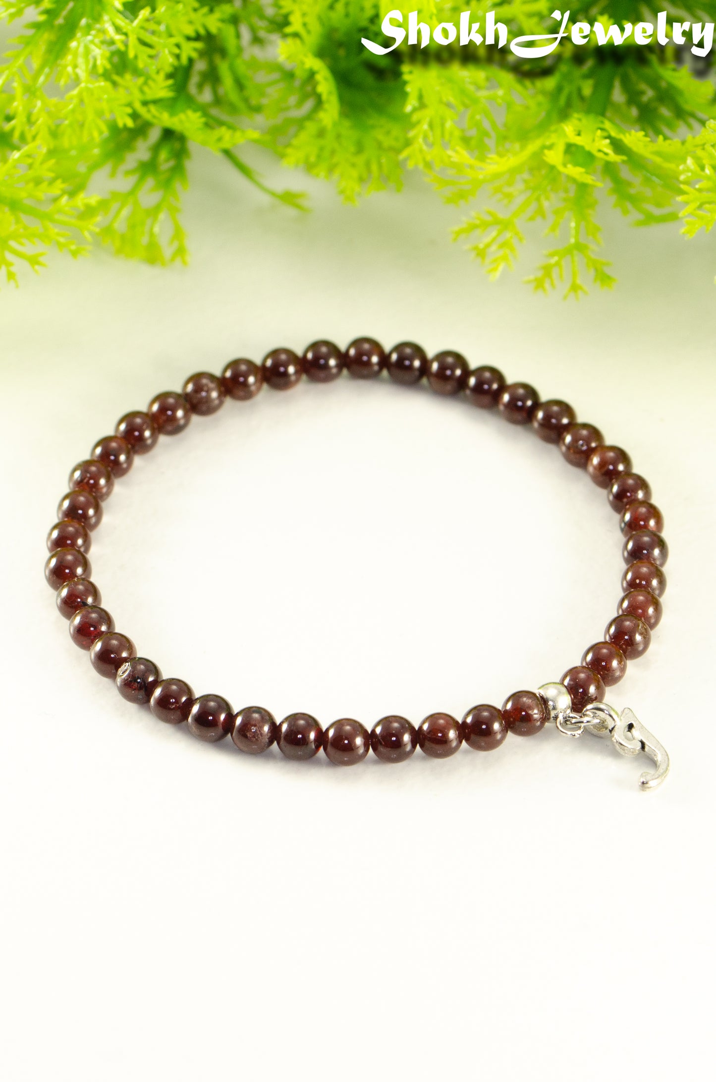 Close up of 4mm Garnet Bracelet with Initial.