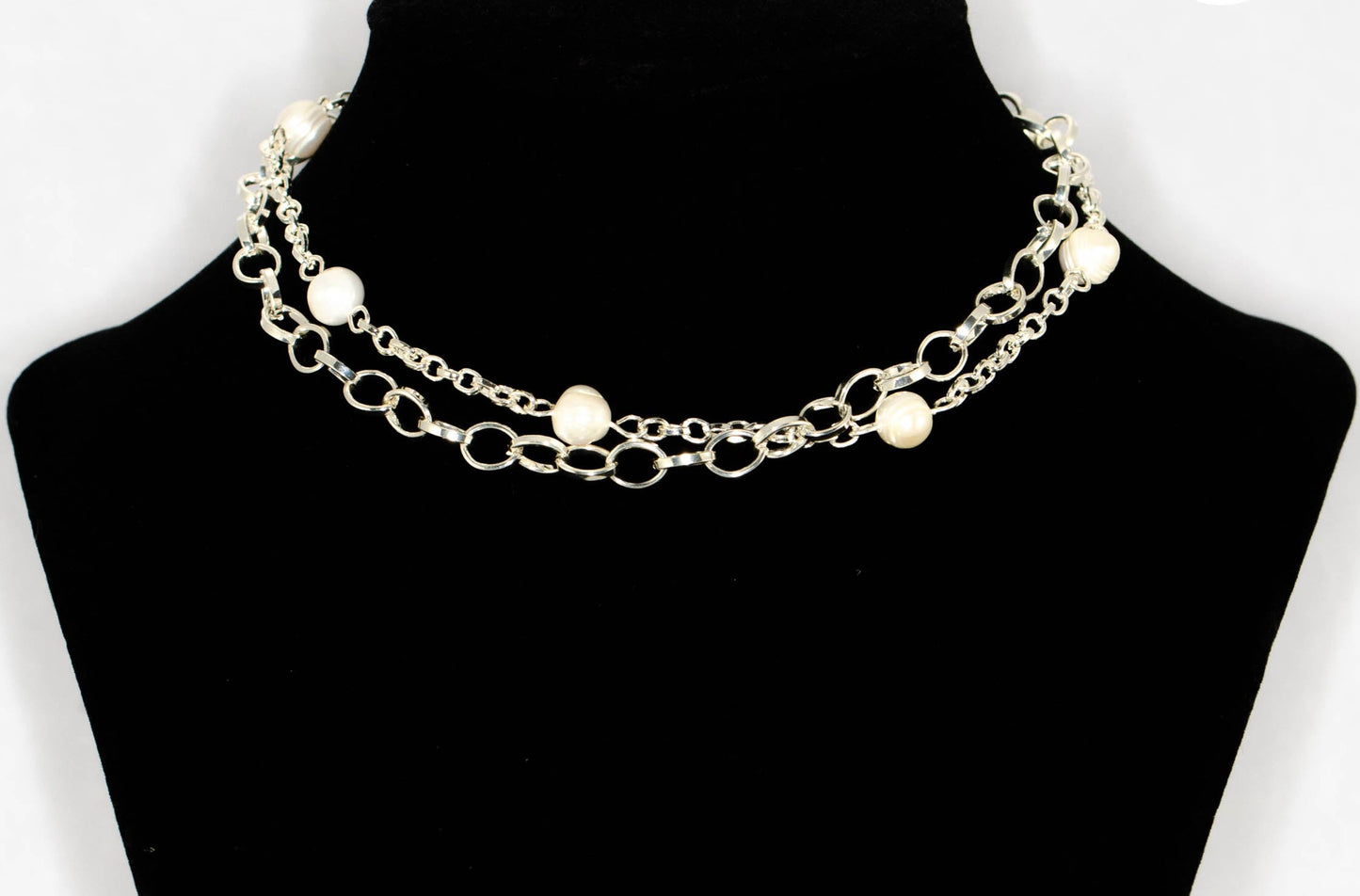Multi Strand Freshwater Pearl and Chunky Chain Choker Necklace displayed on a bust.