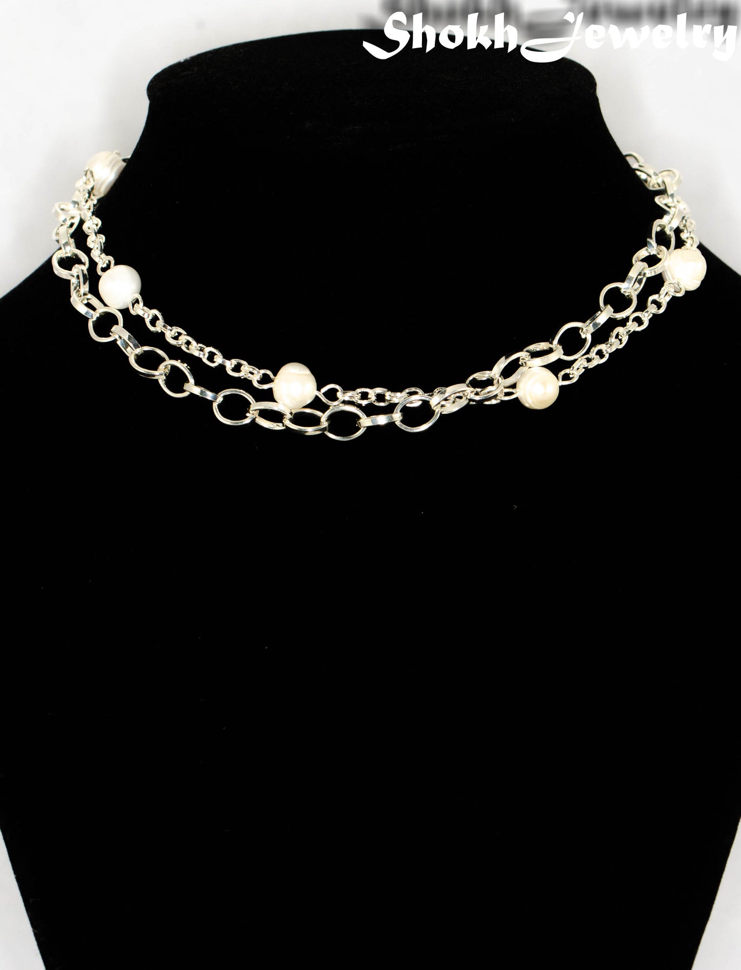 Close up of Multi Strand Freshwater Pearl and Chunky Chain Choker Necklace.