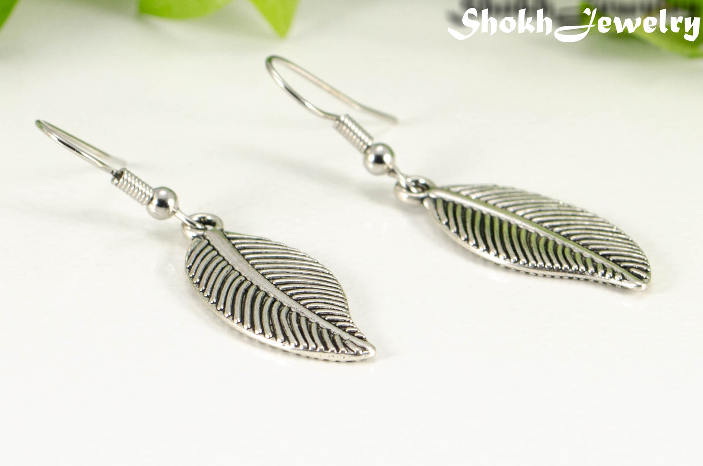 Close up of Tibetan Silver Leaf Charm Earrings.