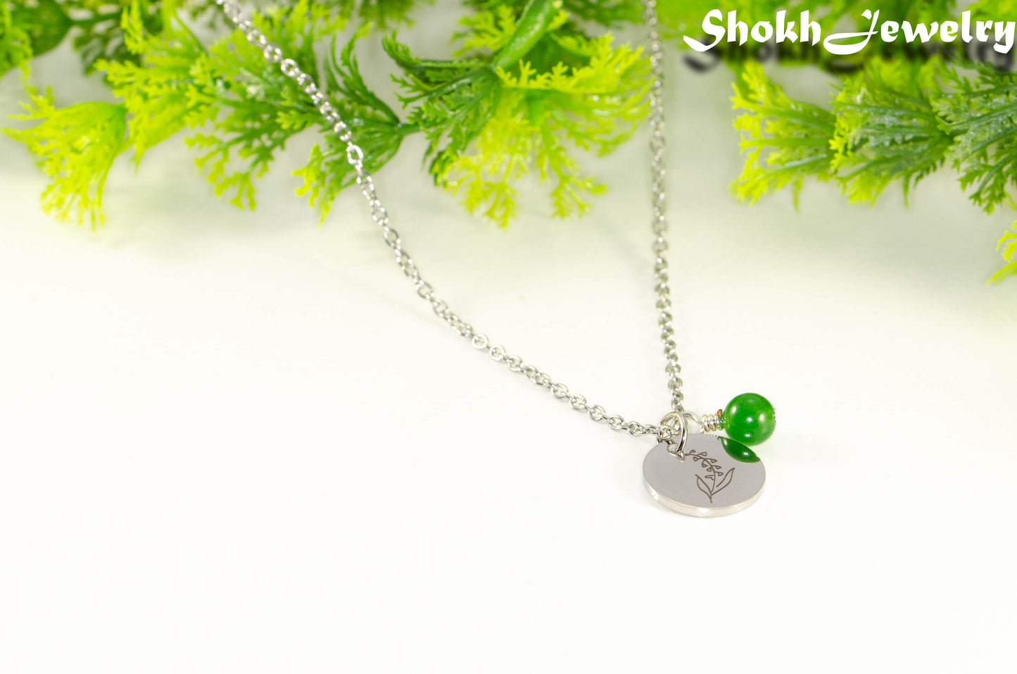 May Birth Flower Necklace with Emerald Birthstone Pendant.