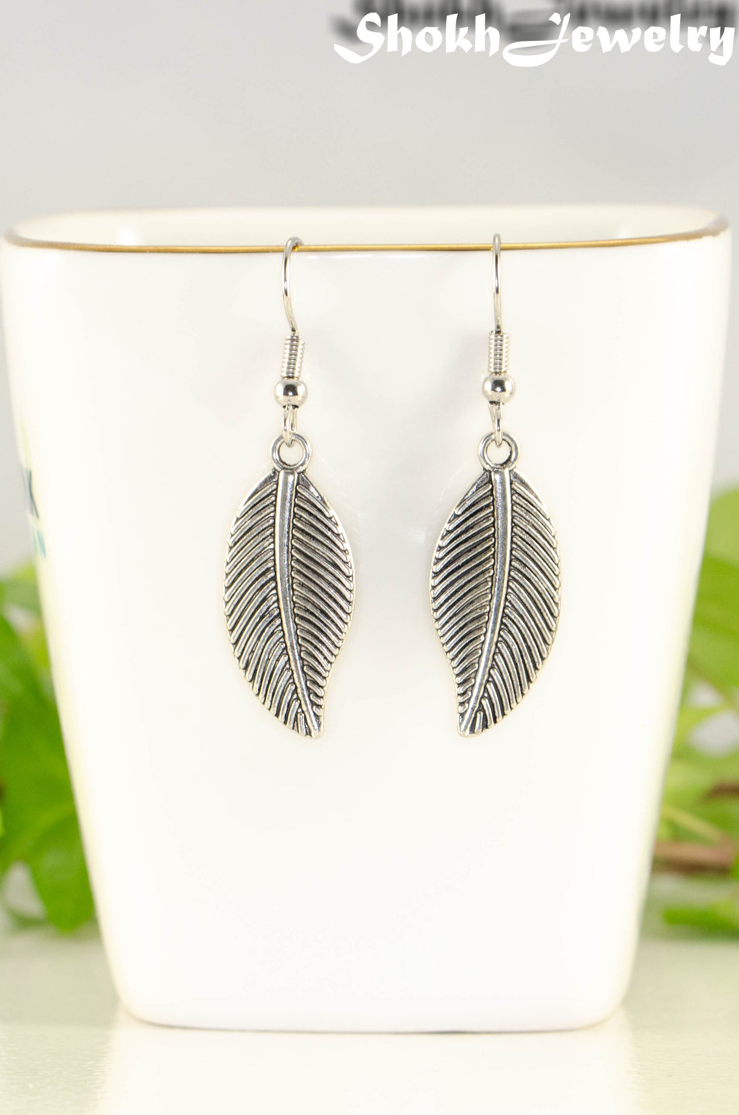 Close up of Tibetan Silver Leaf Charm Earrings.