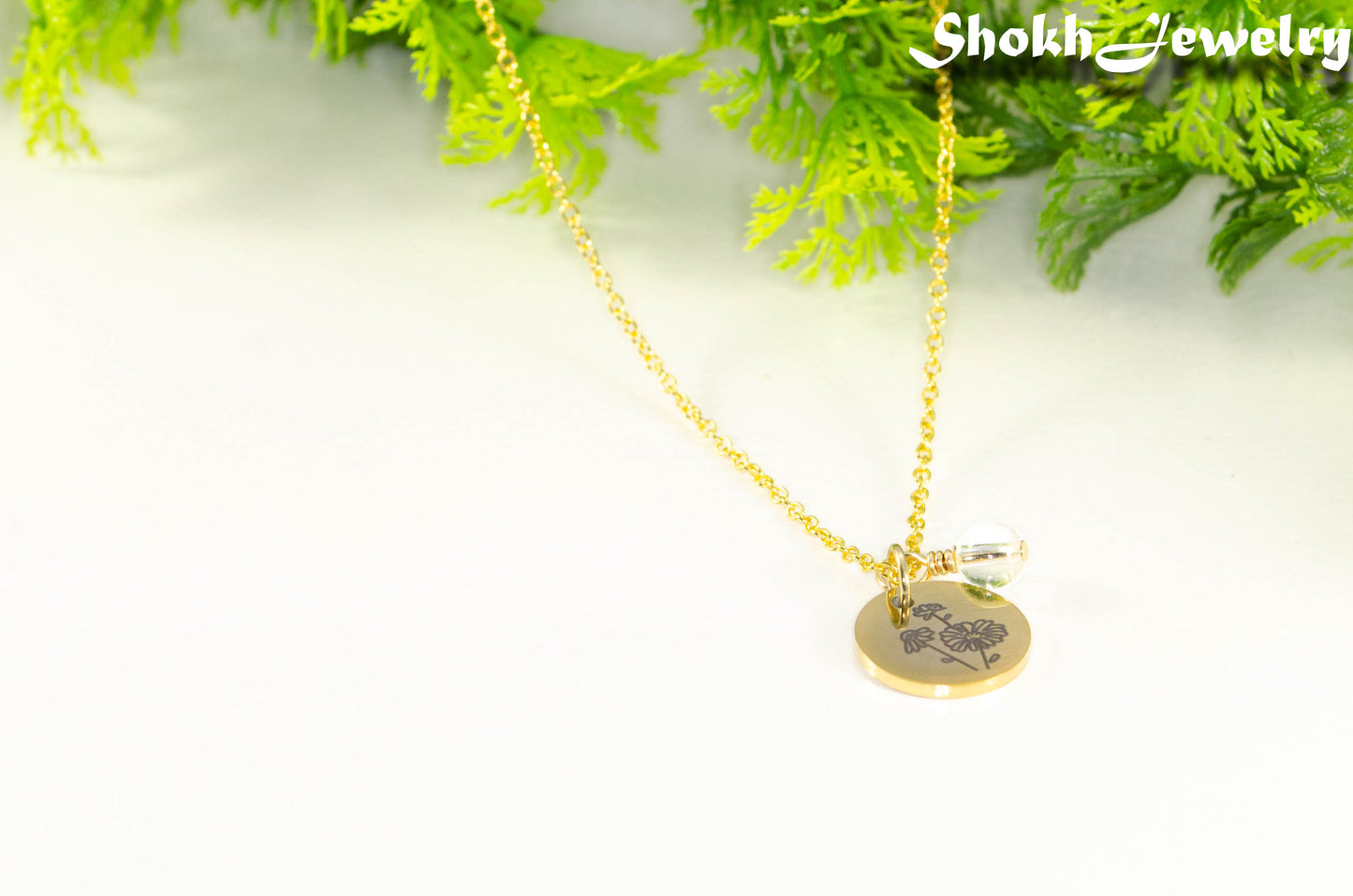 Gold Plated April Birth Flower Necklace with Clear Quartz Birthstone Pendant.