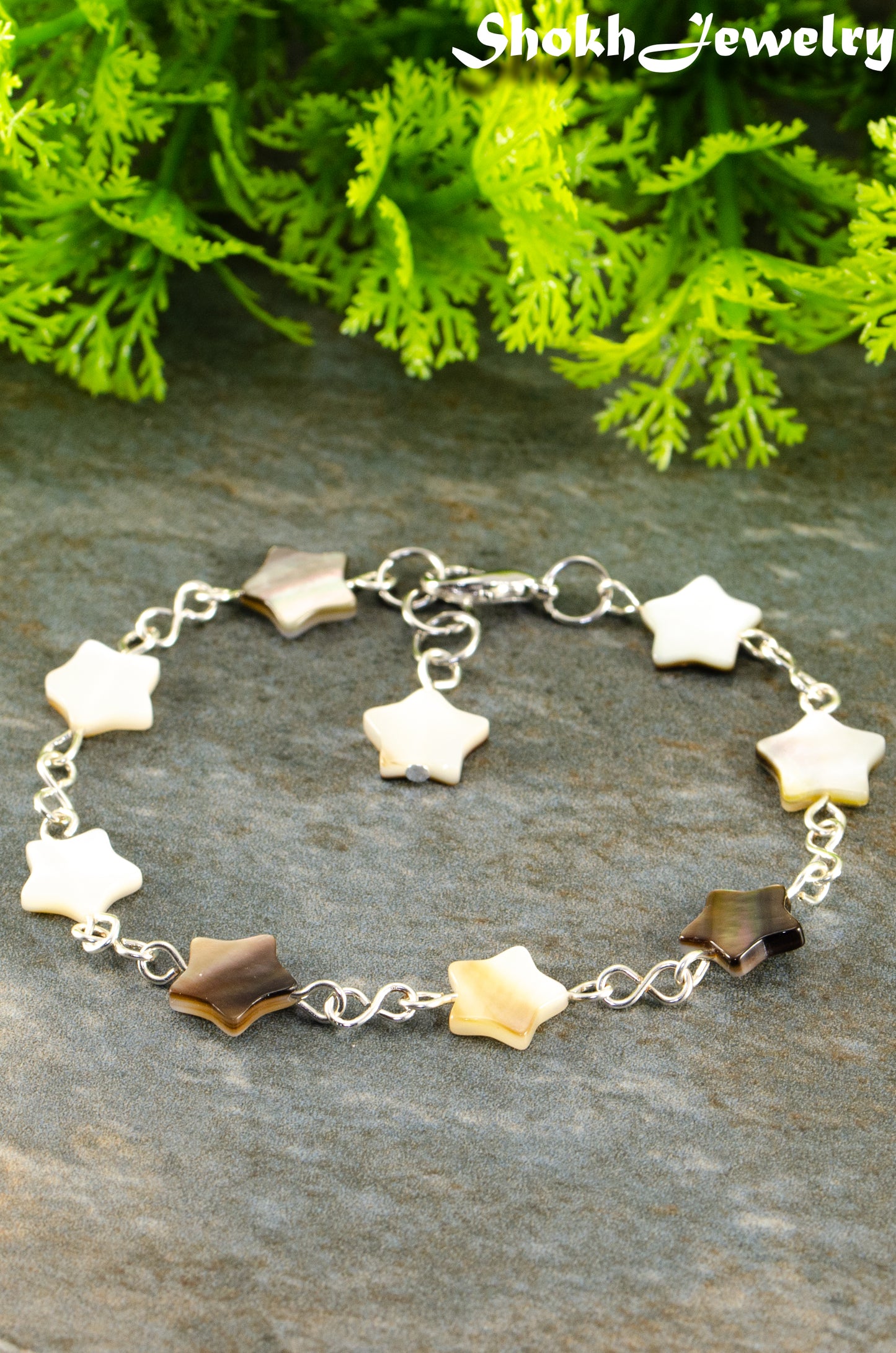 Close up of Natural Gray Seashell Star Link Bracelet.