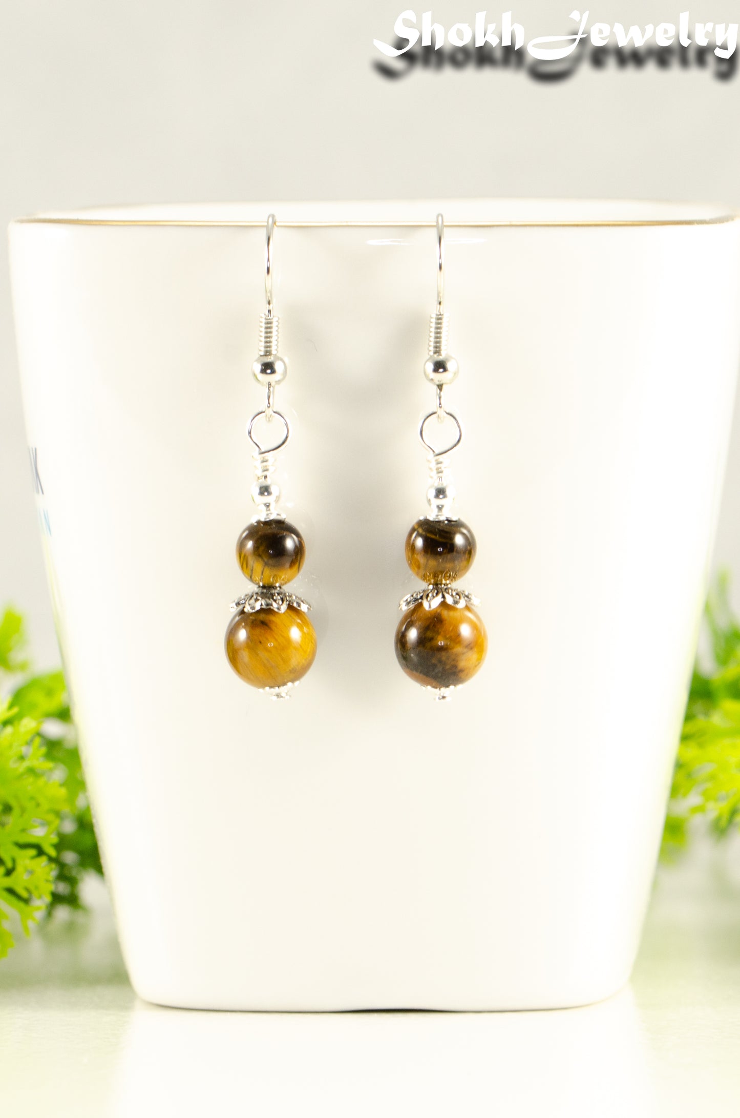 Close up of Small Tiger's Eye Earrings.