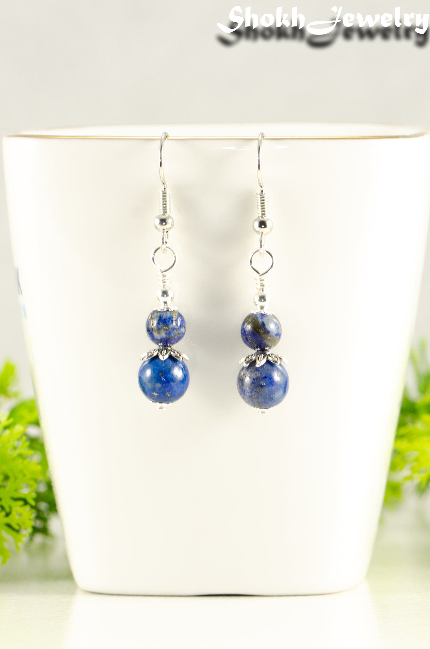 Close up of Small Lapis Lazuli Earrings.