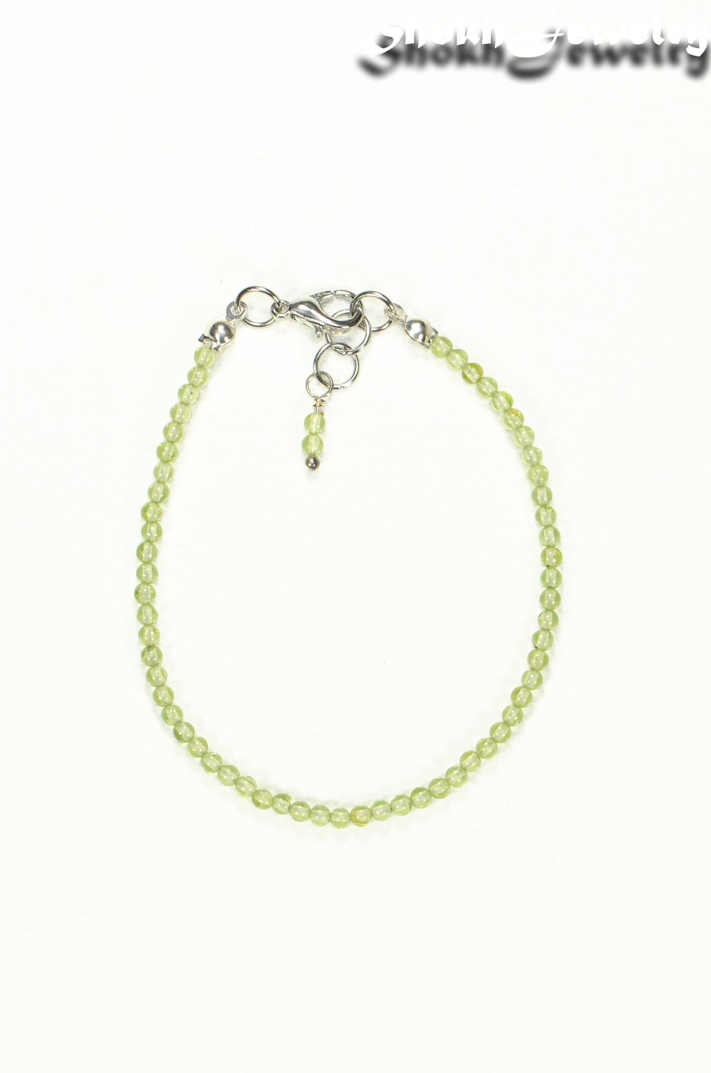 Top view of Dainty Peridot Bracelet with Clasp.