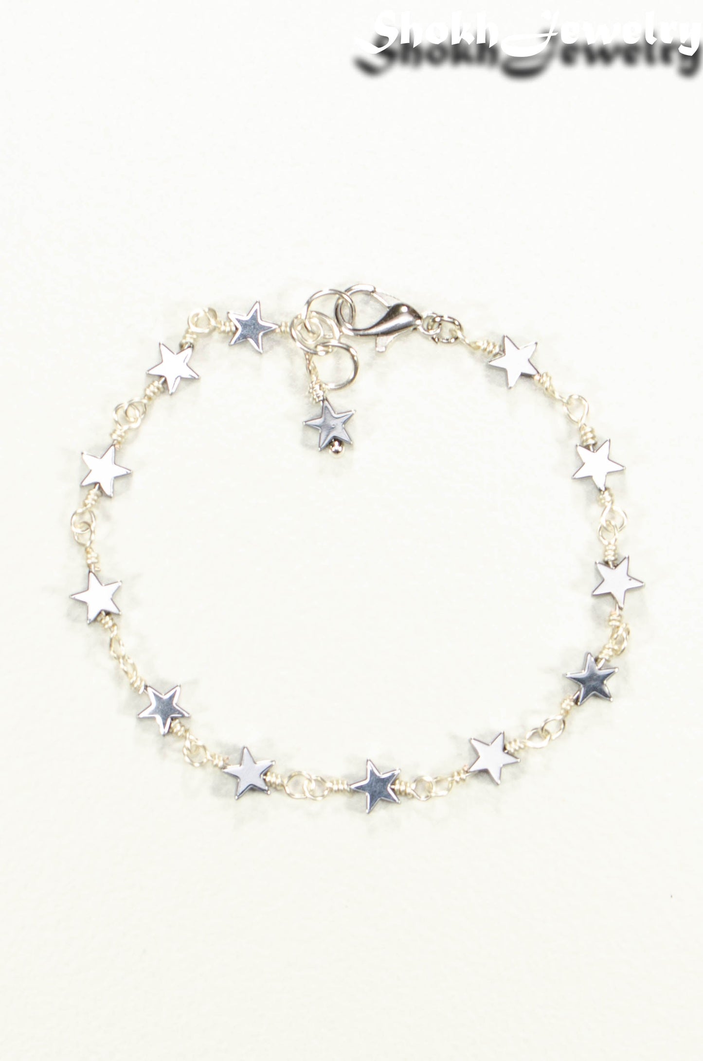 Top view of Small Hematite Star Link Anklet.