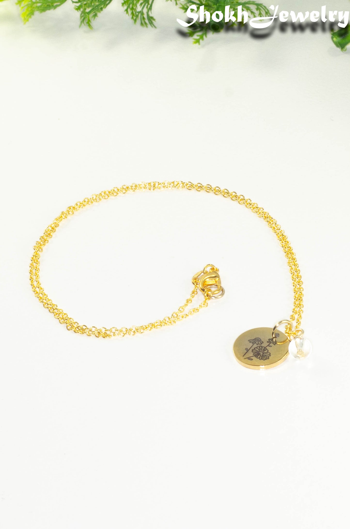 Gold Plated April Birth Flower Necklace with Clear Quartz Birthstone Pendant.