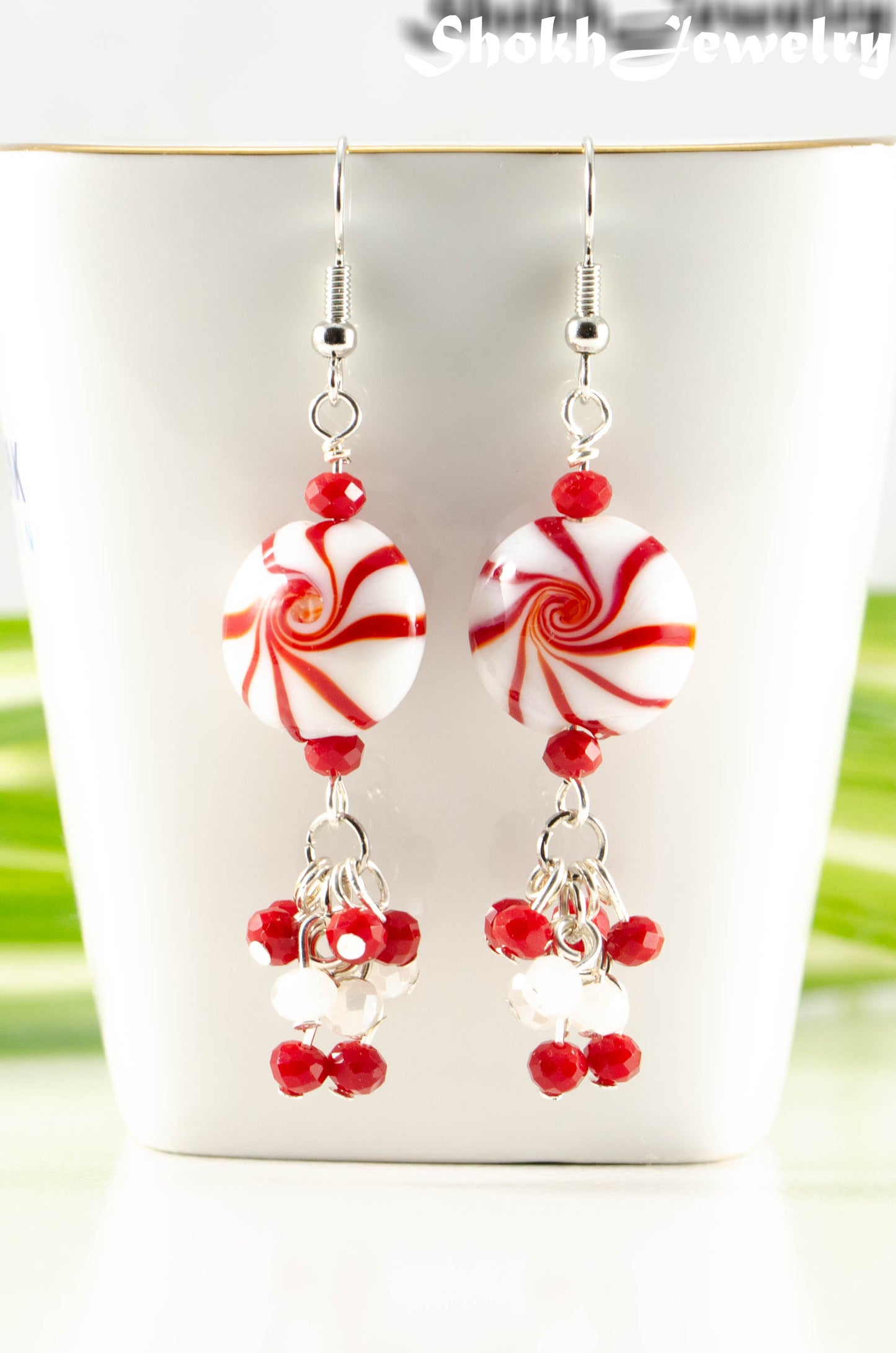 Close up of Statement Christmas Peppermint Glass Bead Earrings.