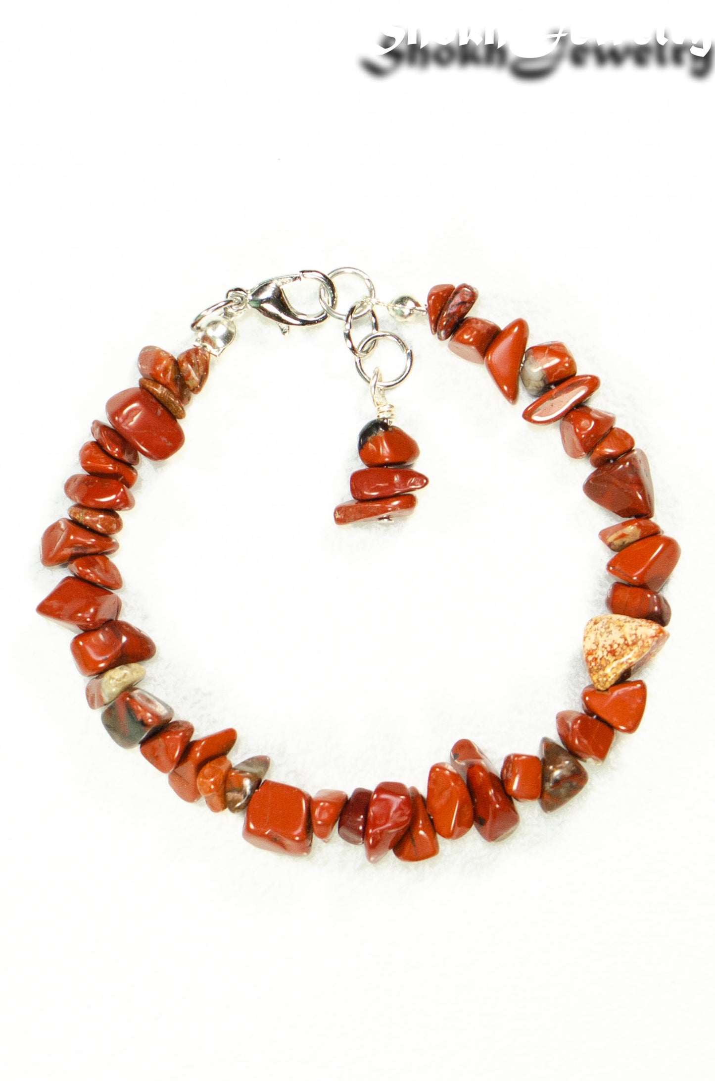 Close up of Natural Red Jasper Crystal Chip Bracelet.