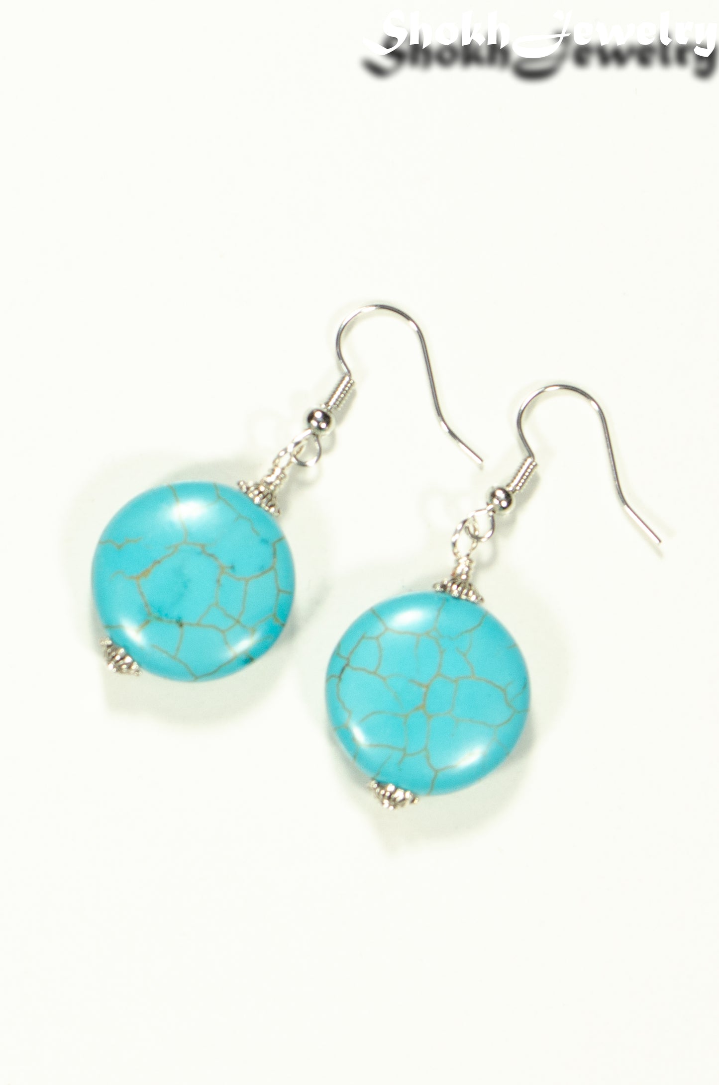 Top view of 20mm Turquoise Howlite Earrings.