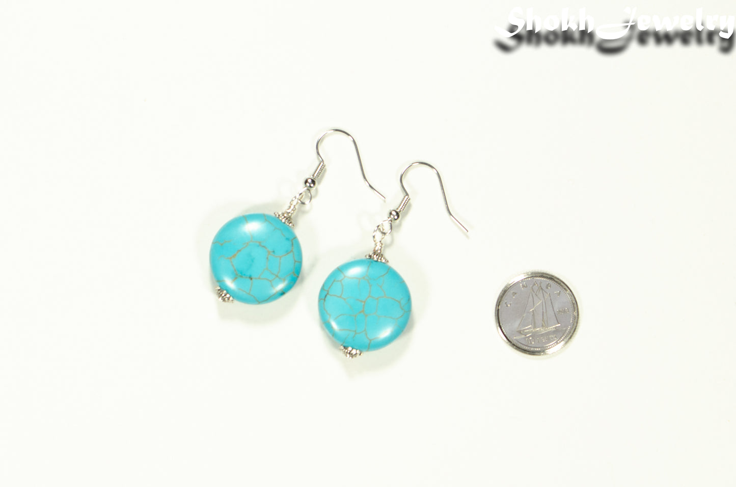 20mm Turquoise Howlite Earrings beside a dime.