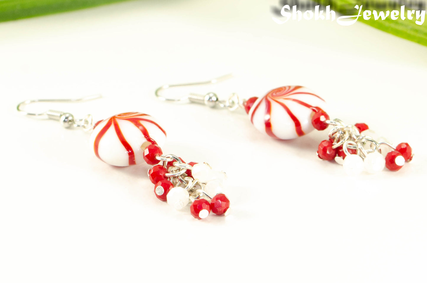Close up of Statement Christmas Peppermint Glass Bead Earrings.