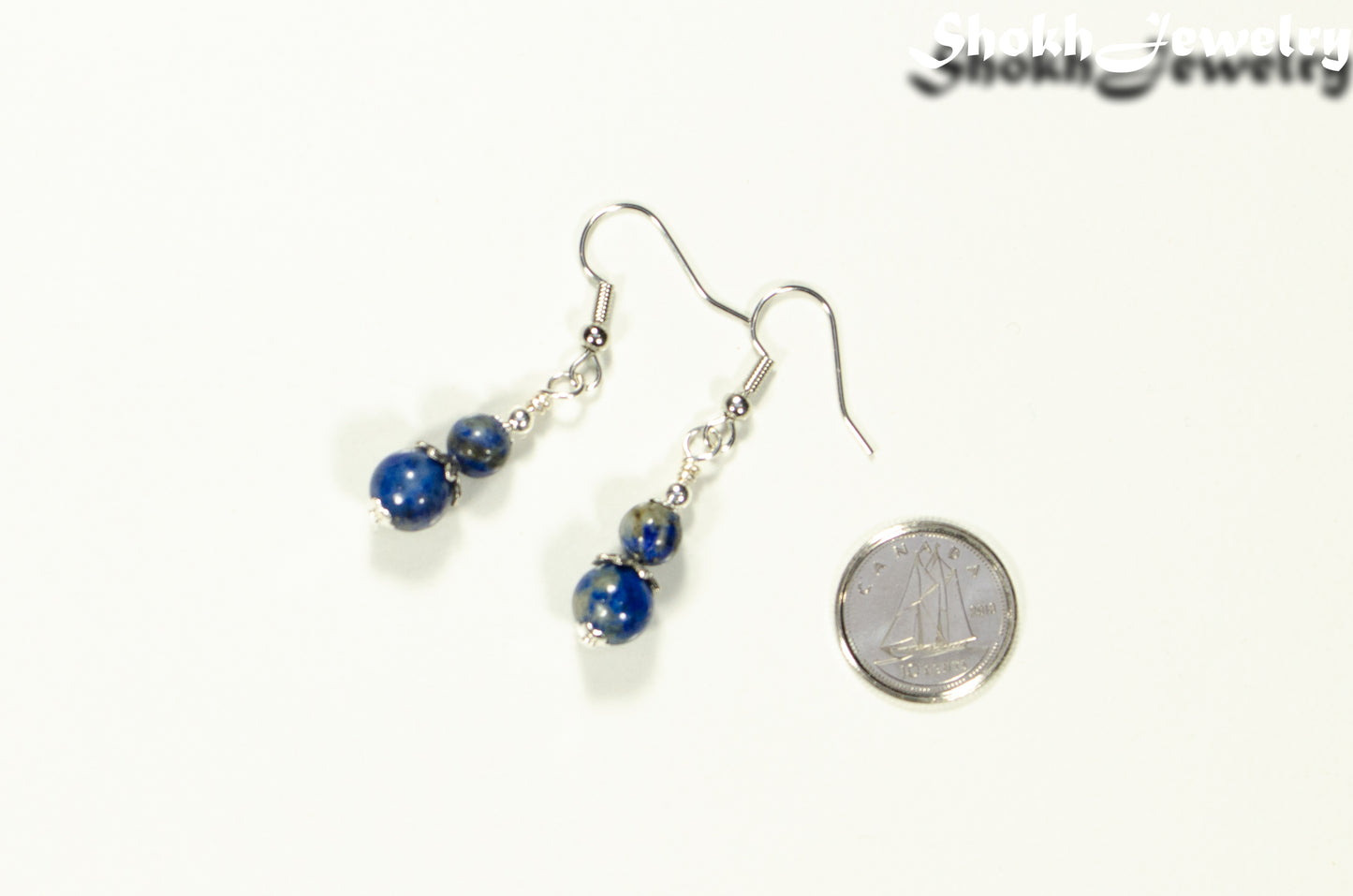 Small Lapis Lazuli Earrings beside a dime.