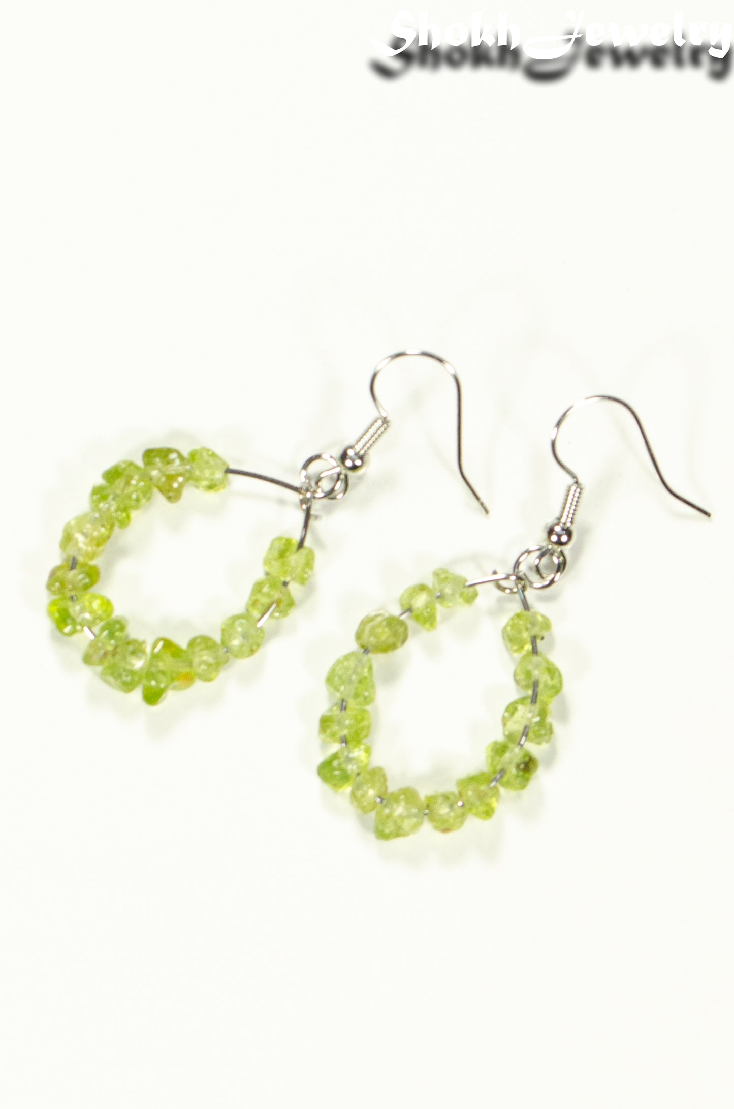 Top view of Natural Peridot Crystal Chip Hoop Earrings.