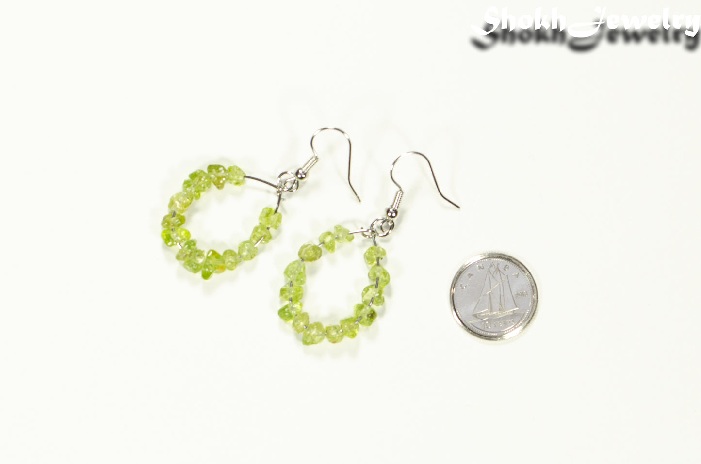 Natural Peridot Crystal Chip Hoop Earrings beside a dime.