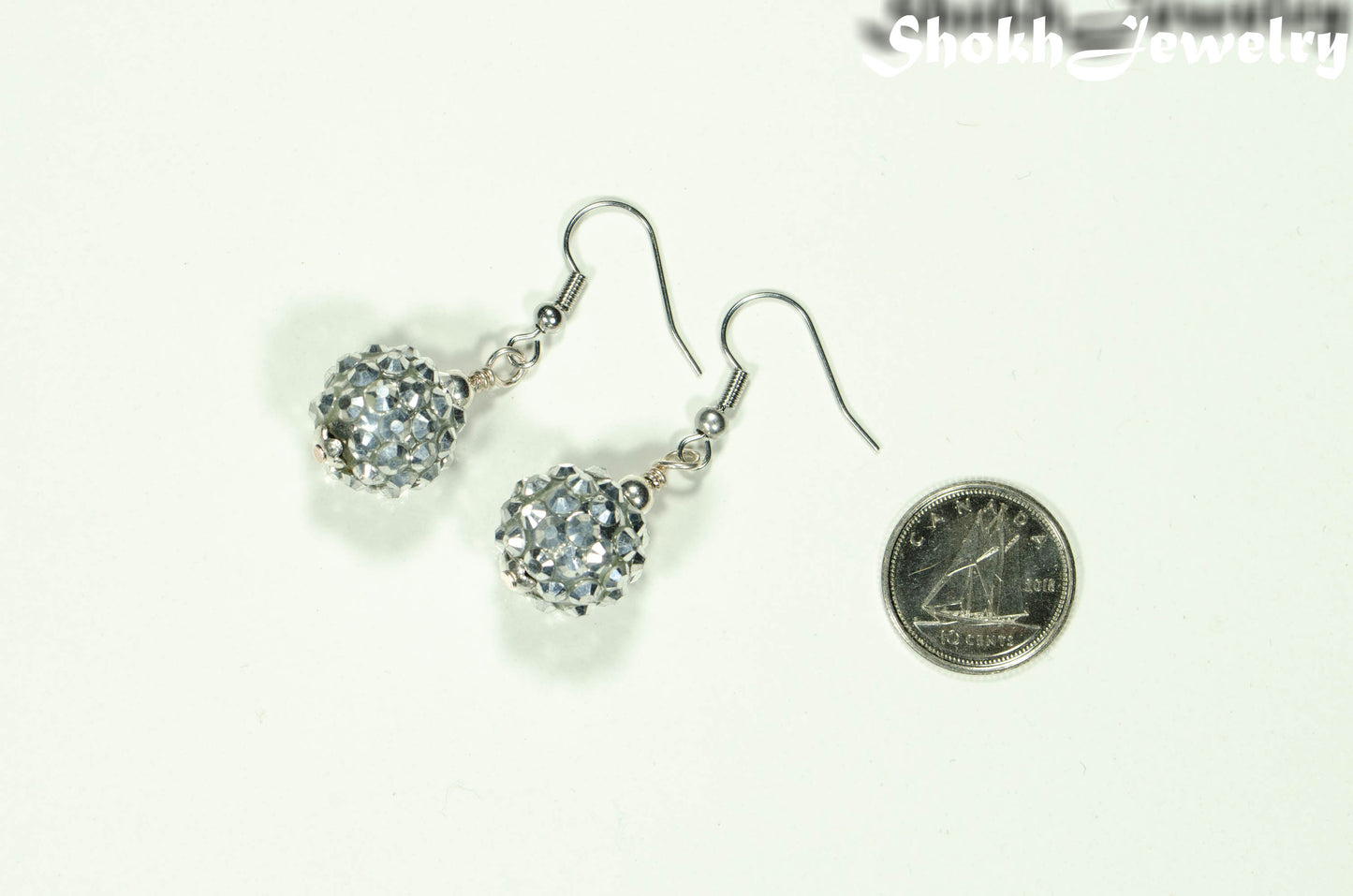 14mm Rhinestone Disco Ball Earrings beside a dime.