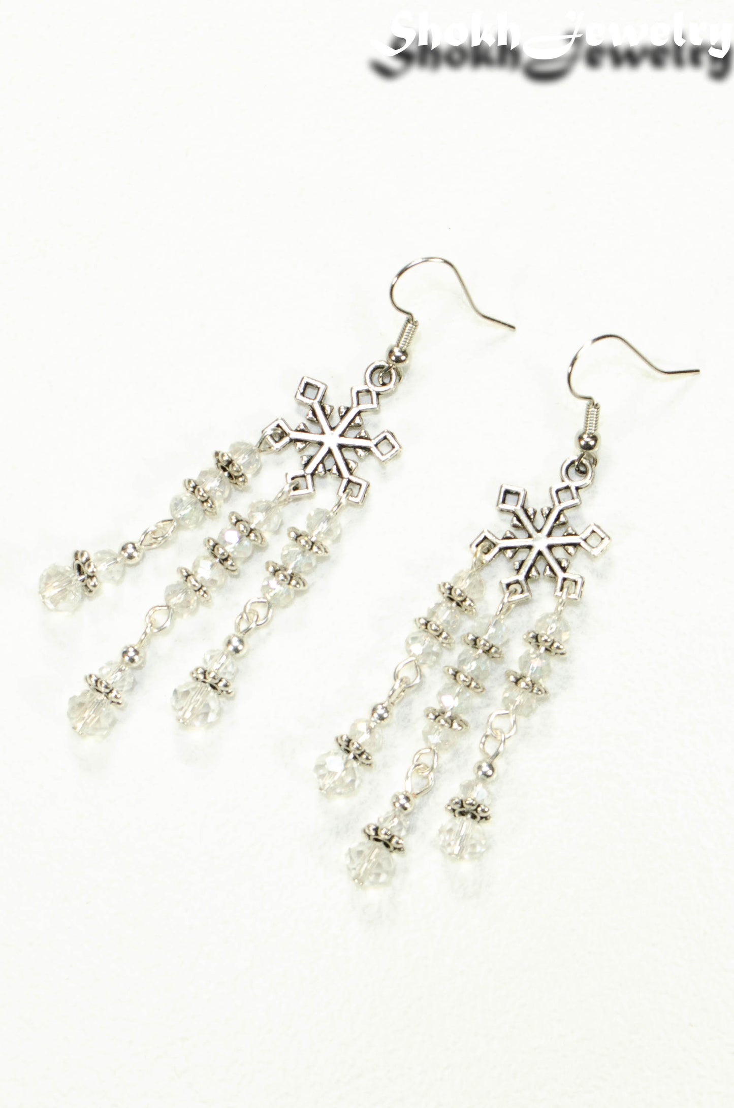 Top view of Clear Glass Crystal Chandelier and Snowflakes Earrings.