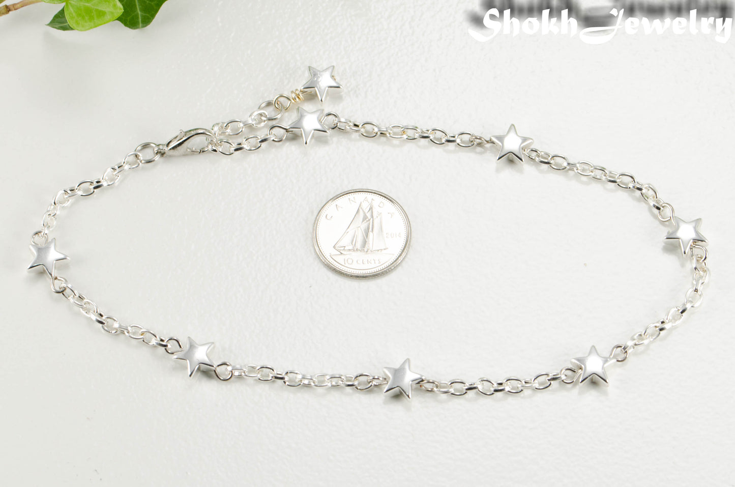 Hematite Star and Dainty Chain Choker Necklace beside a dime.