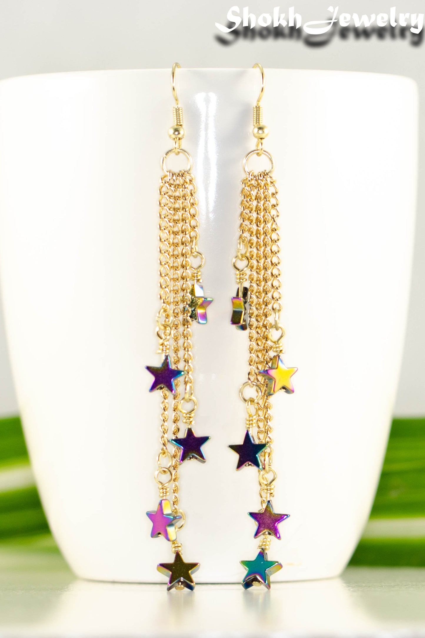 Close up of Extra Long Rainbow Hematite Star Earrings.