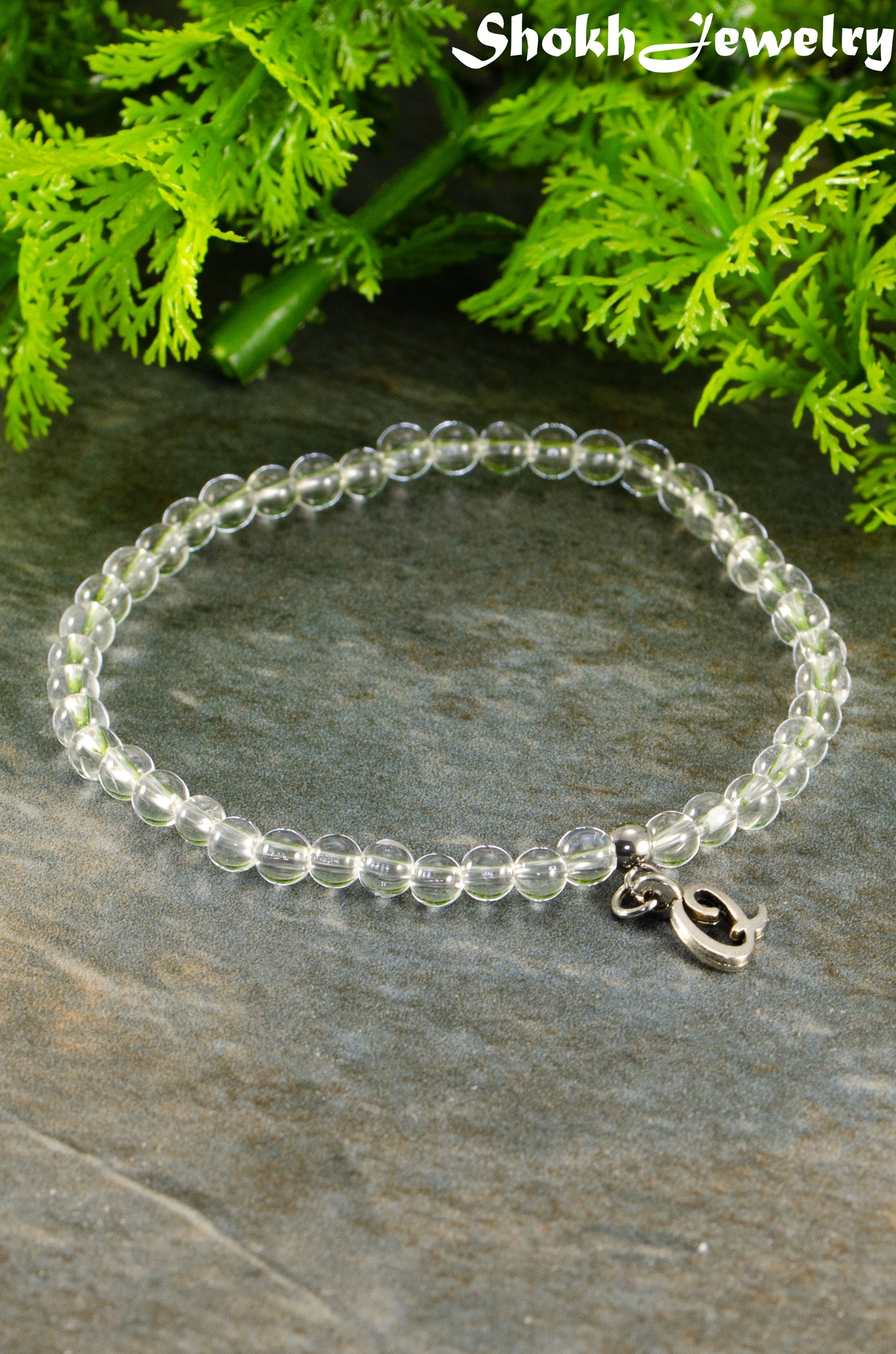 Close up of 4mm Clear Quartz Bracelet with Initial.