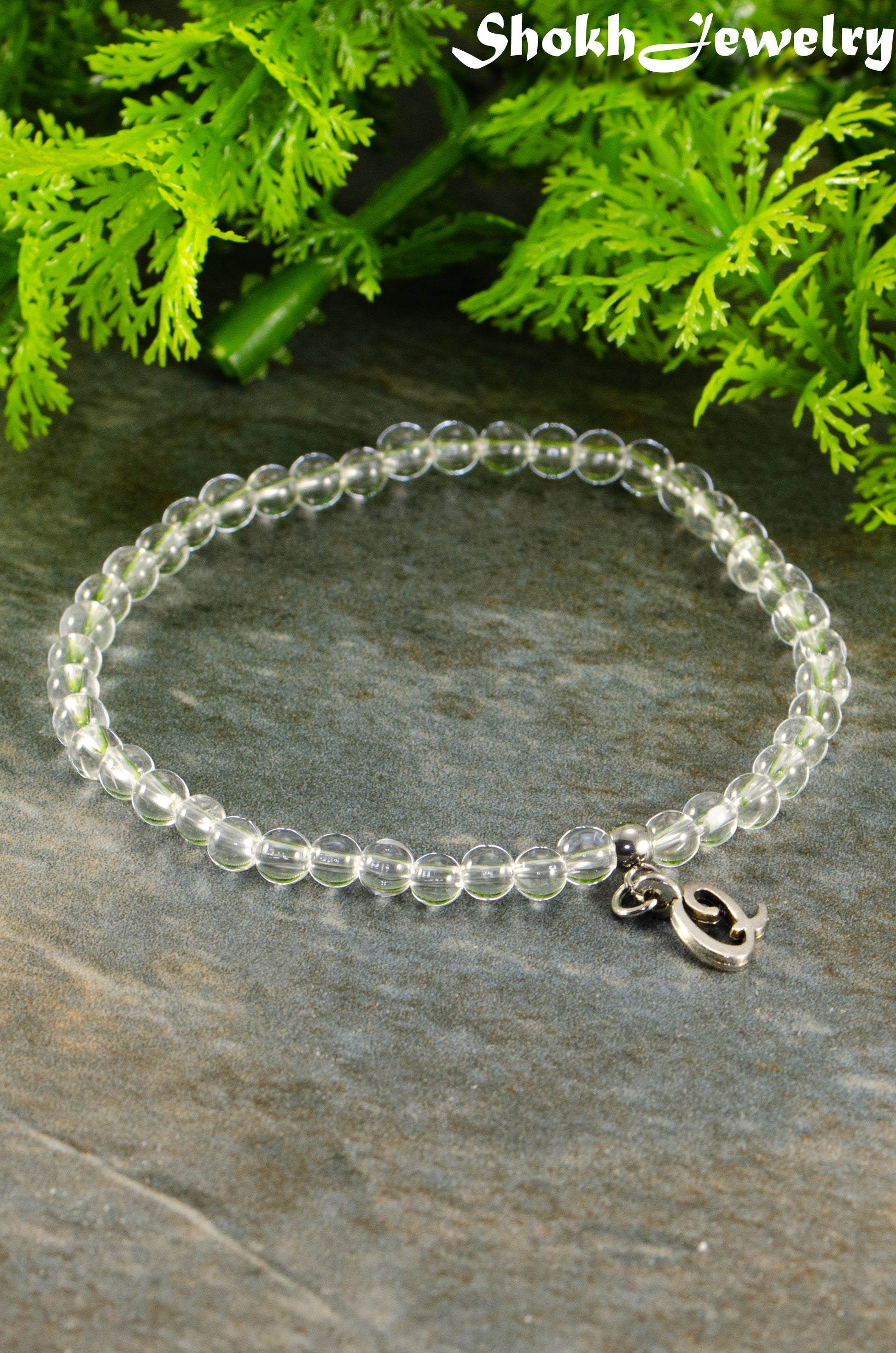 Close up of 4mm Clear Quartz Bracelet with Initial.