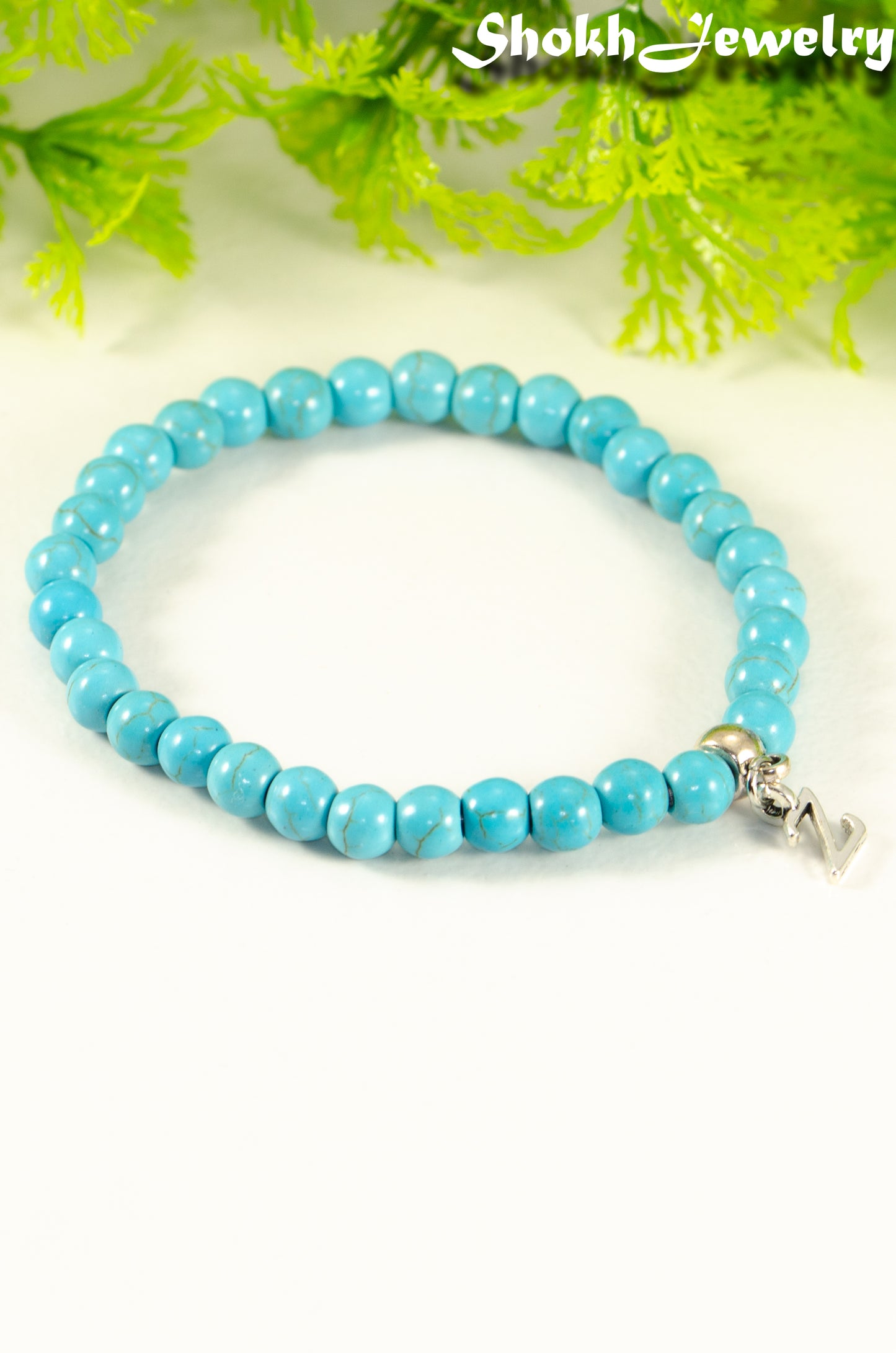 Close up of 6mm Turquoise Howlite Bracelet with Initial.
