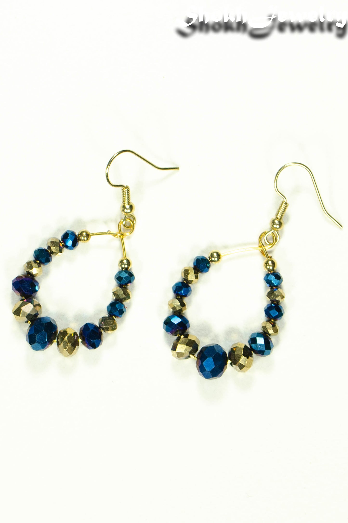 Top view of Blue and Gold Glass Crystal Hoop Earrings.