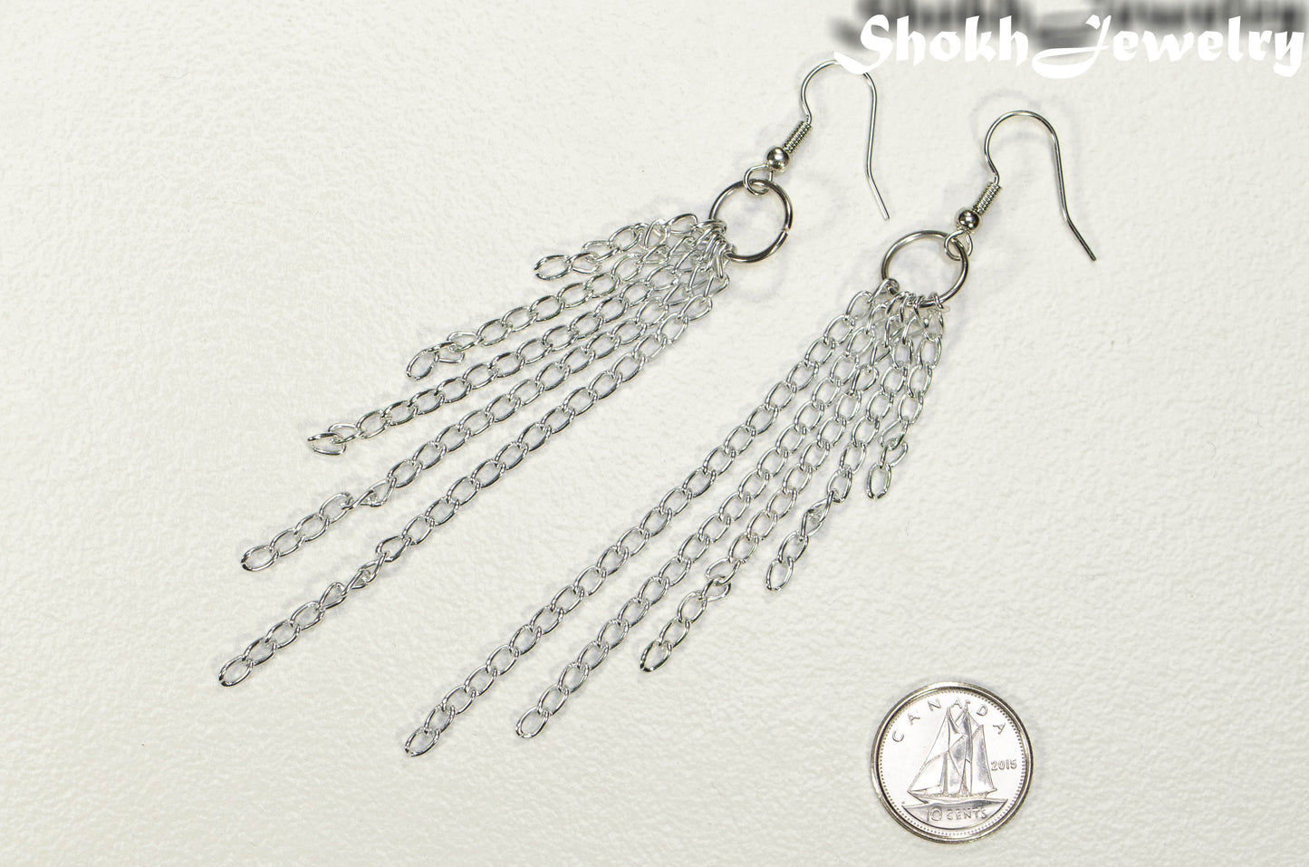 Extra Long Aluminum Chain Earrings beside a dime.